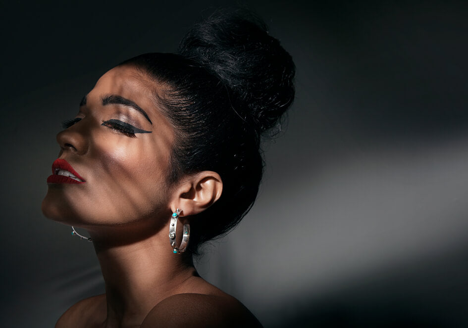 Model wearing a pair of Anuja hoops from Hill to Street