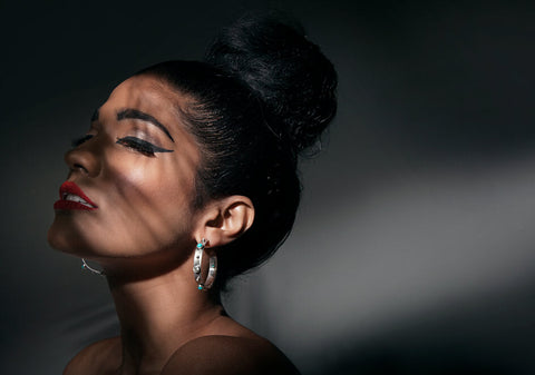 Model wearing a pair of Anuja hoops from Hill to Street