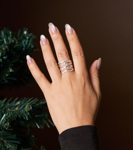 Model wearing Onda Ring, a sculptural pure silver ring for everyday styling.