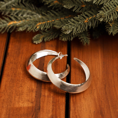 Vedra Hoop Earrings in pure silver showing wide, sculptural silhouette.
