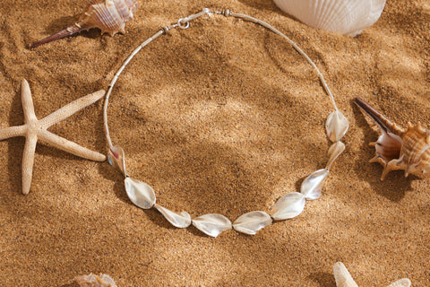 Hamley Necklace in pure silver showing a mix of rice beads and sculpted wave-like beads.