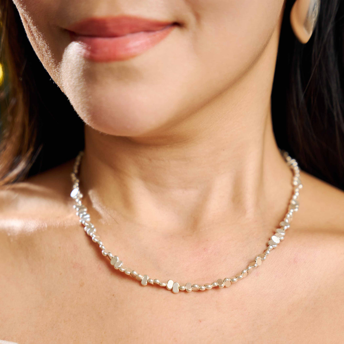 Model wearing Zaria Necklace, a refined pure silver beaded necklace for everyday styling.