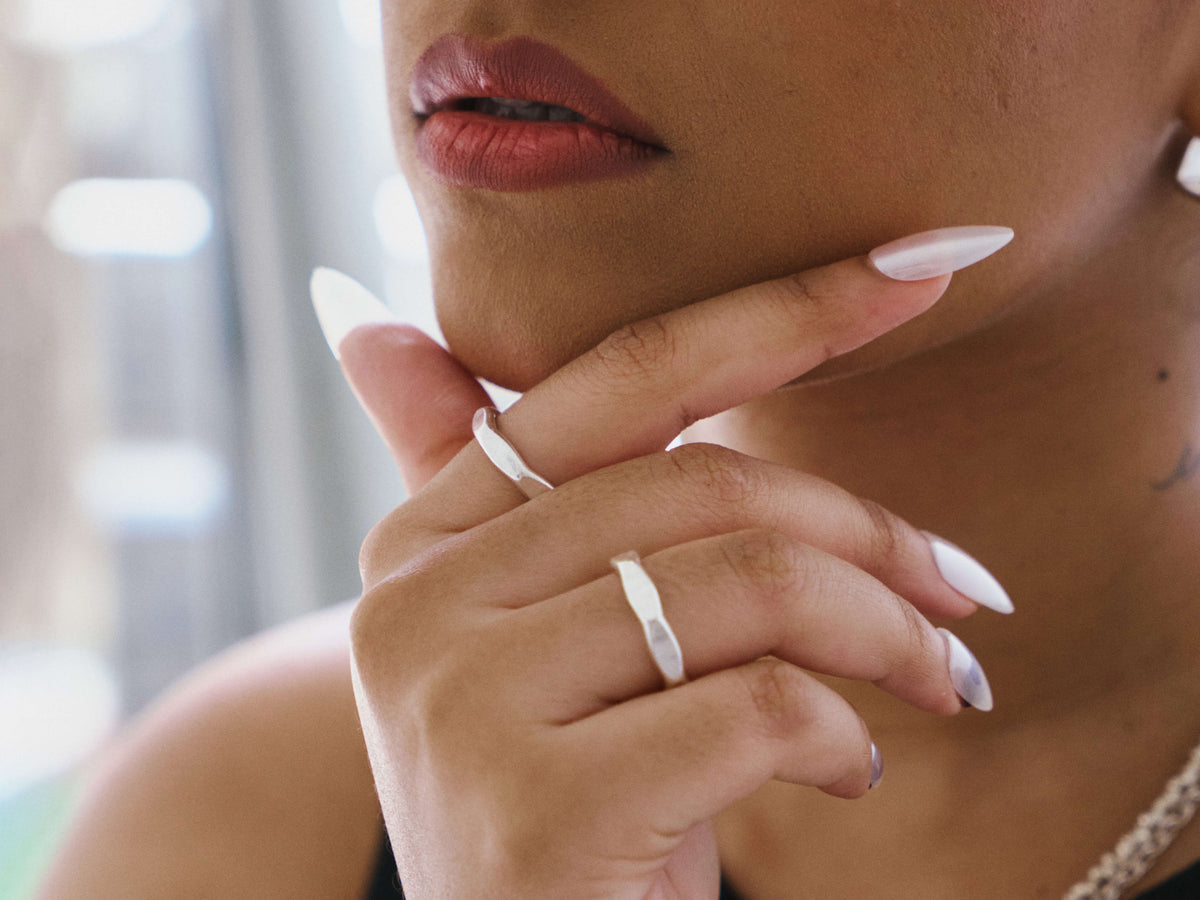 Venn Ring in pure silver showing smooth organic curve and lightly hammered surface.
