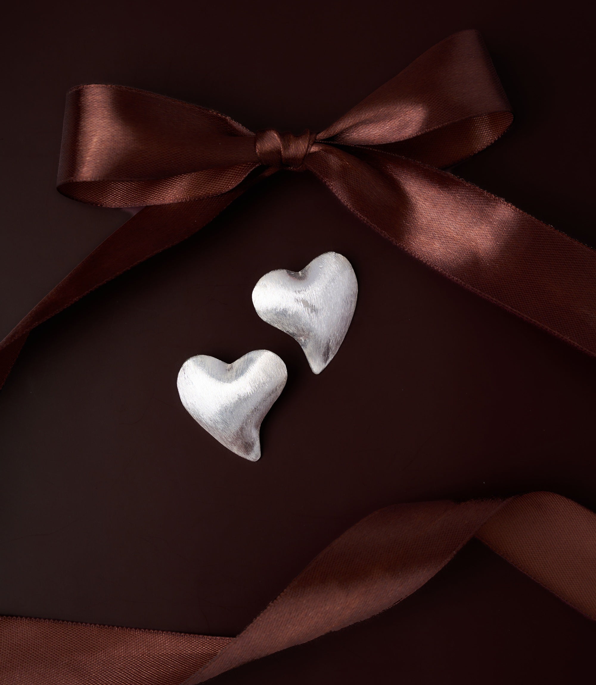 Ari Heart Earrings in pure silver showing soft matte texture and organic sculptural heart form.