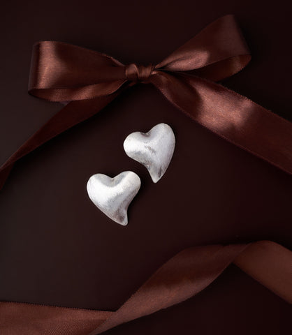 Ari Heart Earrings in pure silver showing soft matte texture and organic sculptural heart form.