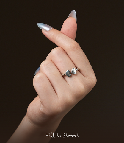 Model wearing Double Heart Ring, a minimalist pure silver heart ring for everyday styling.
