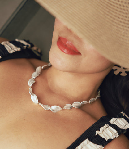 Model wearing the Hamley Necklace, a minimal coastal pure silver beaded necklace for everyday styling.