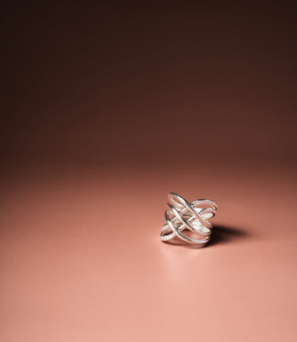 The Viera Layer Ring in pure silver featuring softly interwoven layered bands with sculptural detailing.