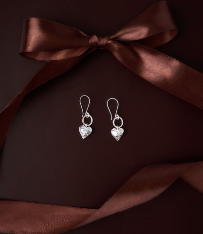Elin Heart Drop Earrings in pure silver showing delicately hammered heart charm on fine silver loop.