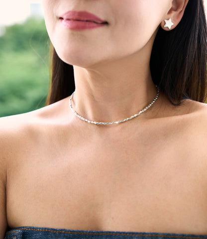 Model wearing The Livia Facet Necklace, a minimal pure silver necklace for everyday styling.