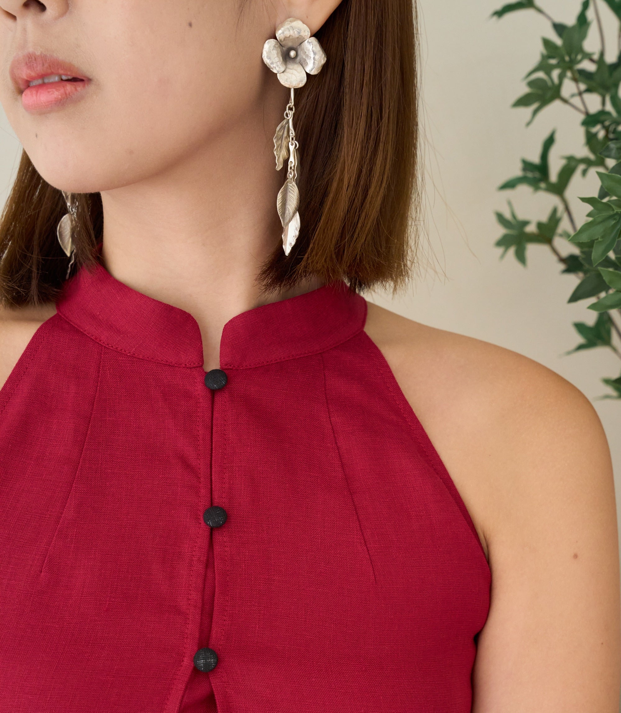 Model wearing Shuyi Earrings, a refined pure silver floral drop earring for everyday styling.