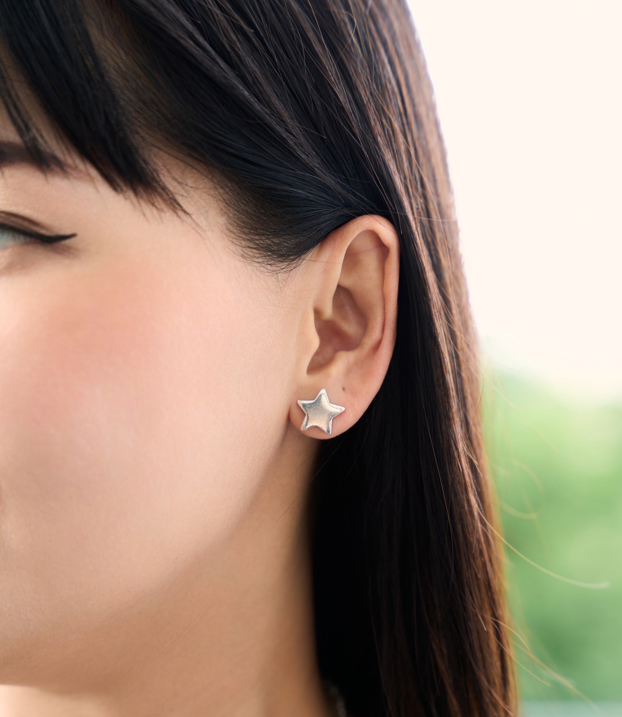 Pure silver Stella Stud Earrings worn on ear