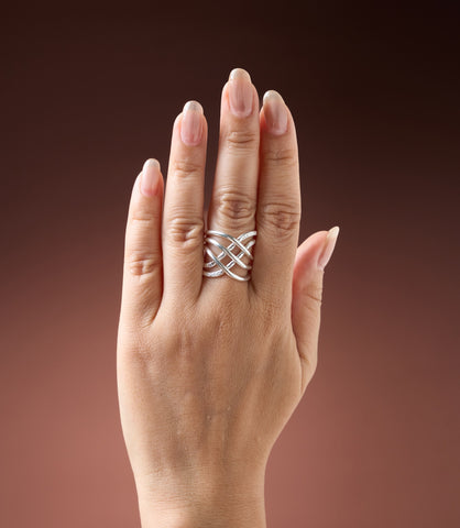 Close-up of The Viera Layer Ring showing textured pure silver layers and sculptural curves.