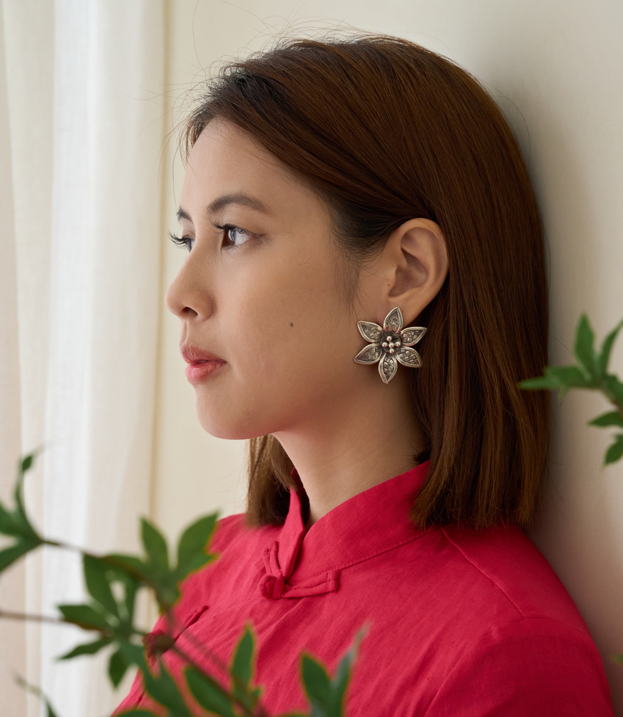 Model wearing Xinya Earrings, a refined floral pure silver earring for everyday styling.