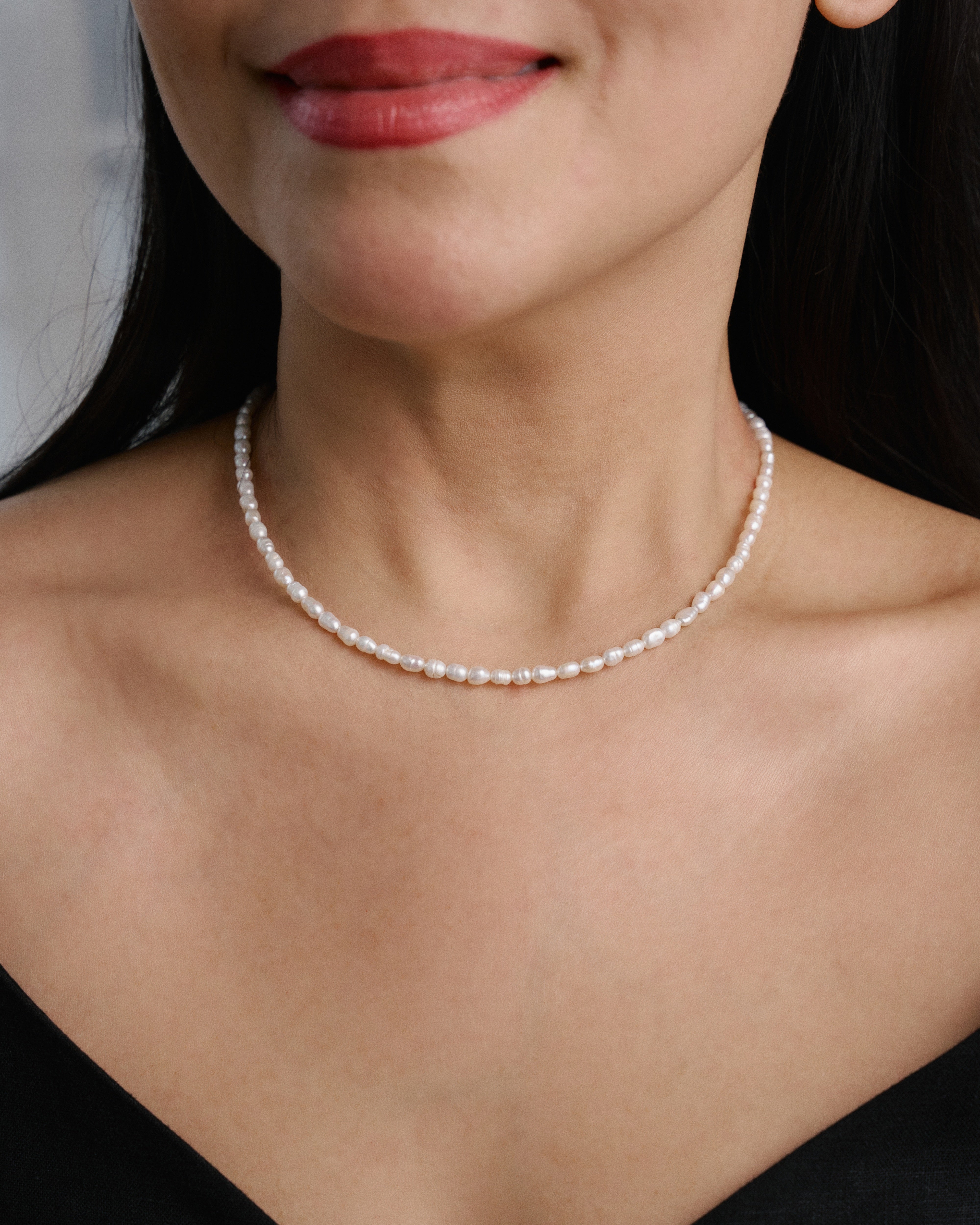 Model wearing The Mireya Pearl Necklace, an elegant pearl necklace for timeless everyday styling.