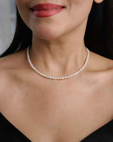 Model wearing The Mireya Pearl Necklace, an elegant pearl necklace for timeless everyday styling.